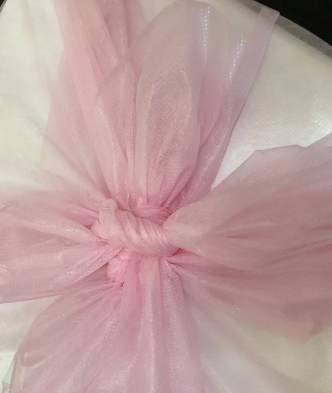 Gift Cheesecake — wrapped in pink organza with a ribbon